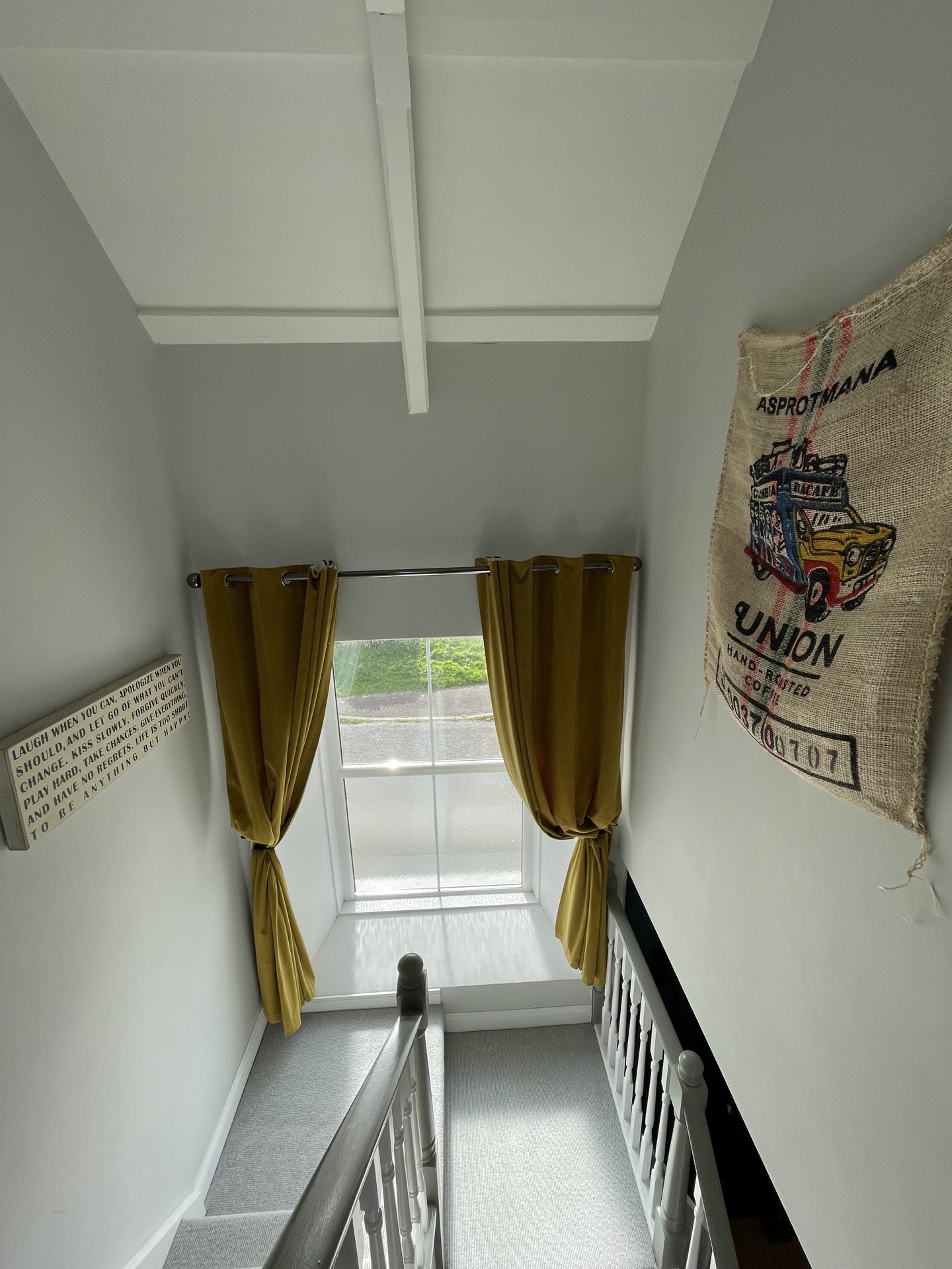 Bright stairwell landing with window