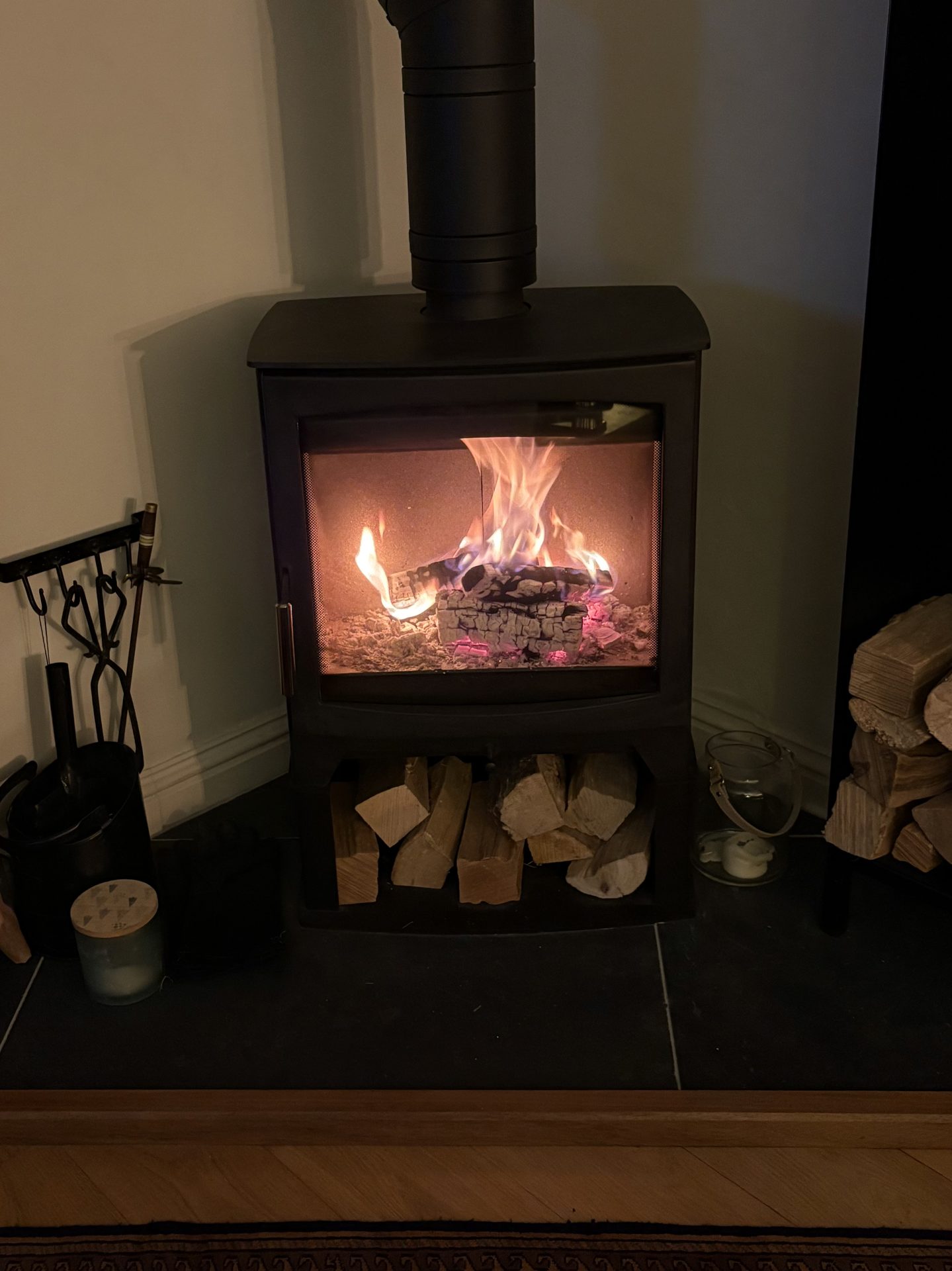 Wood-burning stove lit in the evening